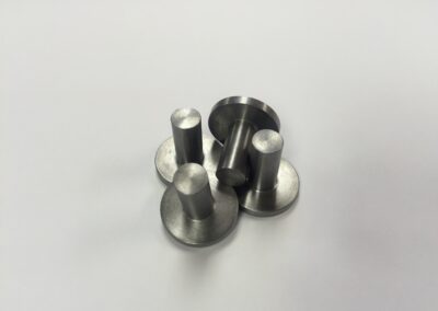 4 metal pins with rounded edges